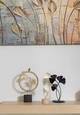 a table with two lamps and a painting on the wall at Elegant Apt 50meters Close Acropolis in Athens