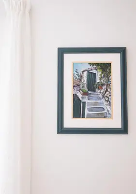 a picture of a painting hanging on a wall at Elegant Apt 50meters Close Acropolis in Athens