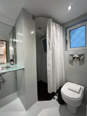 a bathroom with a toilet and a sink at Mosaikon Guesthouses #Vasilikis Str in Athens