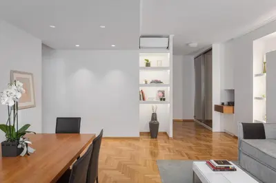 a living room with a table and a couch at Acropolis Vibe Residence in Athens