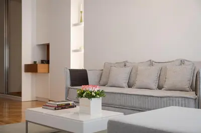 a living room with a couch and a table at Acropolis Vibe Residence in Athens