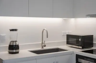 a kitchen with a sink and a blender on a counter at Acropolis Vibe Residence in Athens