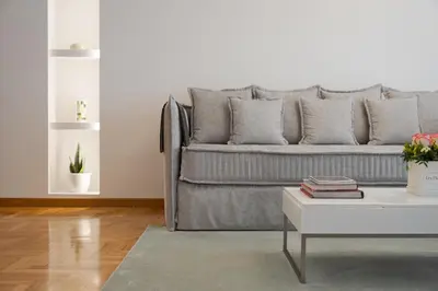 a living room with a couch and a coffee table at Acropolis Vibe Residence in Athens