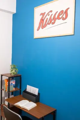 a table with a sign on a blue wall at Agora Apartment Plaka and Acropolis area in Athens