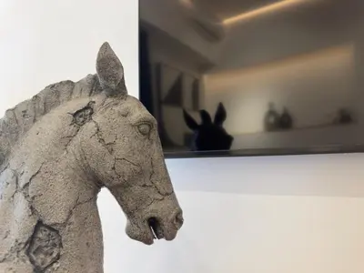 a statue of a horse on a wall with a rabbit at Acropolis Golden View Penthouse in Athens