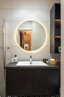 a bathroom with a sink and a mirror at Acropolis Golden View Penthouse in Athens