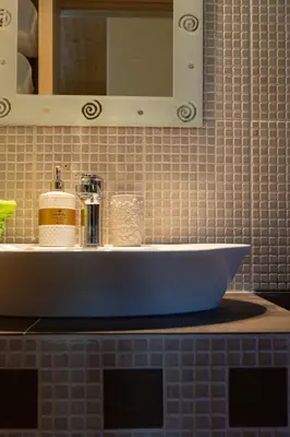a bathroom counter with a sink and a mirror at RELAXING POOL HOUSE IN LAGONISI 2 in Kalívia Thorikoú