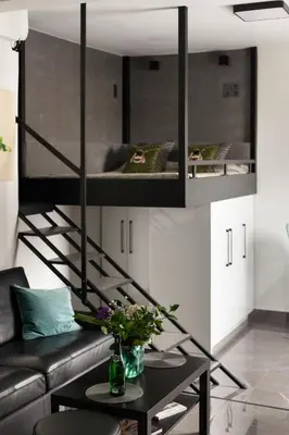 a living room with a loft bed and a table at Smart-Stay Acropolis View in Athens