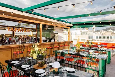 a restaurant with tables and chairs and a bar at Regal Hotel Mitropoleos in Athens