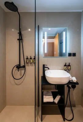a bathroom with a sink and a shower at Regal Hotel Mitropoleos in Athens