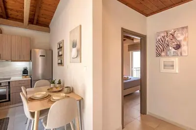 a kitchen with a table and a zebra picture on the wall at Stunning and spacious apt in Athens in Athens