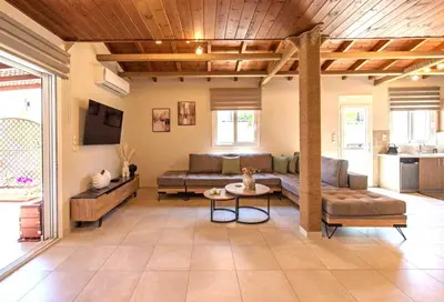 a living room with a couch and a table at Stunning and spacious apt in Athens in Athens