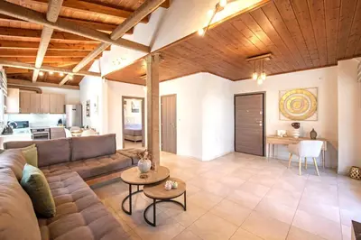 a living room with a couch and a table at Stunning and spacious apt in Athens in Athens