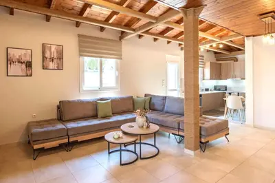 a living room with a couch and a table at Stunning and spacious apt in Athens in Athens