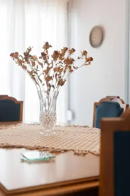 a vase with flowers sitting on a table at Vintage 1BR in Exarchia Timeless in Athens