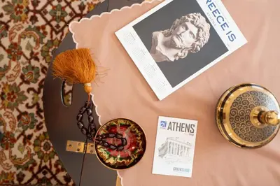 a table with a picture of a man and a plate at Vintage 1BR in Exarchia Timeless in Athens