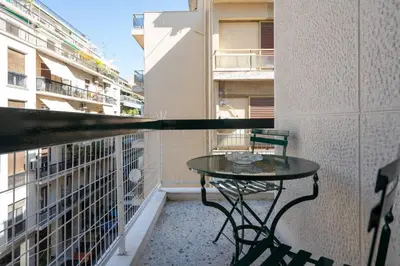 a balcony with a table and chairs on a balcony at Vintage 1BR in Exarchia Timeless in Athens
