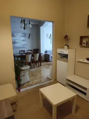 a living room with a table and a dining room at Fully furnished apartment in the heart of Athens in Athens