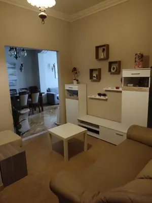 a living room with a couch and a table at Fully furnished apartment in the heart of Athens in Athens