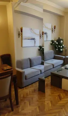 a living room with a couch and a table at Cosy flat in the heart of Athens in Athens