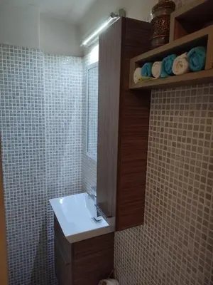 a bathroom with a sink and a toilet in it at Cosy flat in the heart of Athens in Athens