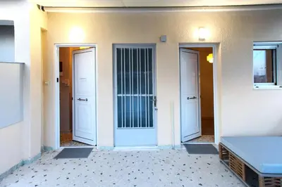 a hallway with three doors and a table on the floor at Artemonos Loft Acropolis View in Athens