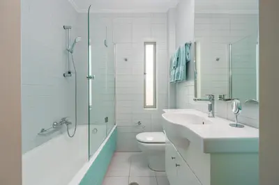 a bathroom with a sink and a toilet and a shower at Vouliagmeni - Apollonos Street in Athens
