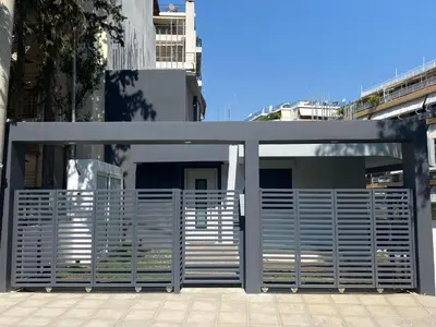 a large metal gate in front of a building at FEELS LIKE HOME in Athens