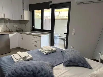 a large bed in a kitchen with two towels on it at FEELS LIKE HOME in Athens