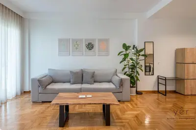 a living room with a couch and a coffee table at Comfort Oasis: Work-Friendly Space w/Fiber Net in Athens
