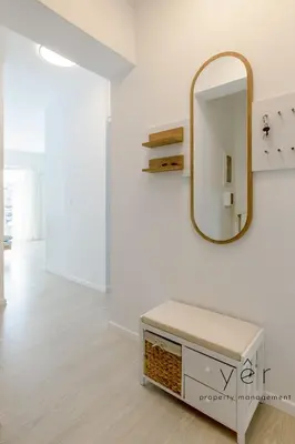 a dressing room with a mirror and a bench at Shell-Charm w/Sea View & Parking in Piraeus