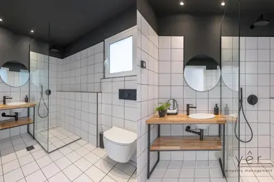a bathroom with a toilet and two sinks and a shower at Luxury Flat w/2Bath - Private Parking @Pasalimani in Piraeus