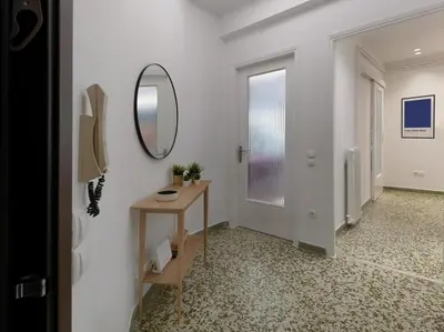 a hallway with a mirror and a table at Stylish Sanctuary, Pangrati Gem Refurbished in Athens