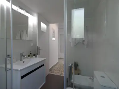 a white bathroom with a sink and a tub at Stylish Sanctuary, Pangrati Gem Refurbished in Athens