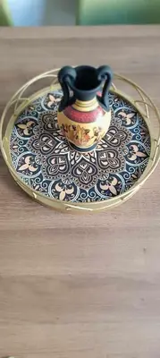 a tea pot on a glass plate on a table at Caryatids Luxury Apartment in Athens