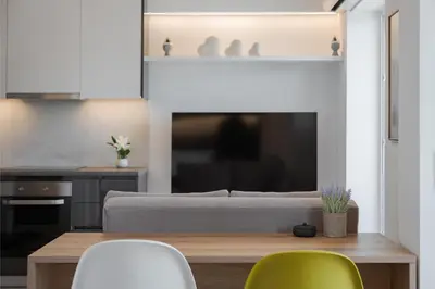 a living room with a couch and a table and chairs at Athenian Riviera Seaside Suite in Athens