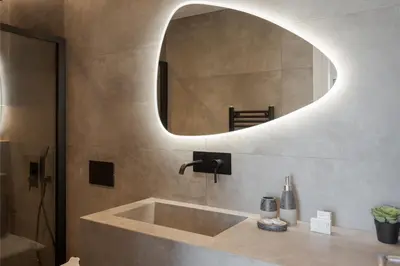 a bathroom with a sink and a mirror at Athenian Riviera Seaside Suite in Athens