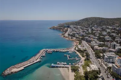 an aerial view of a beach with a harbor at Athenian Riviera Penthouse Apartment in Varkiza