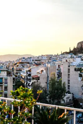 a view of a city with white buildings at Bachelor Penthouse with Roof Garden access, 15 m walk to Acropolis in Athens