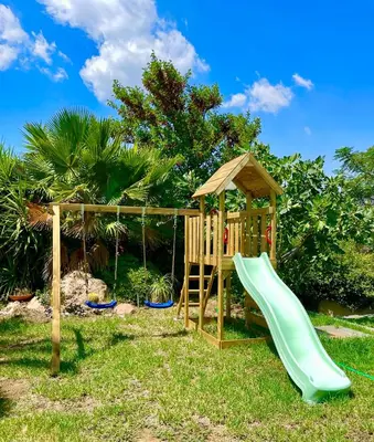 a playground with a slide and a gazebo at Villa Zen Kyriakos Magnificent Vibes in Paianía