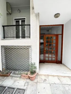 an entrance to a house with a fence and a door at Where Dreams Attend Address! in Athens
