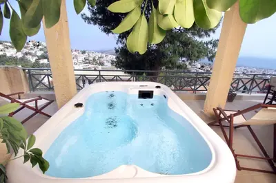 a jacuzzi tub on a balcony with a view at Luxury Home with Jacuzzi and Spectacular Sea Views for 8 Guests in Athens