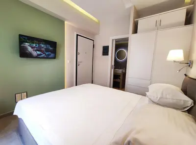 a bedroom with two white beds in a room at Athens Stay 15 in Athens