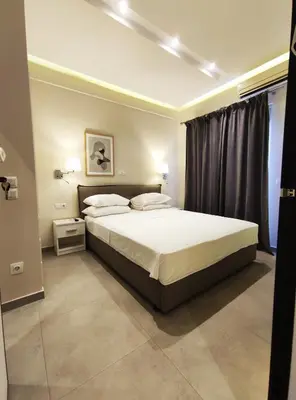 a bedroom with a large bed and a window at Athens Stay 15 in Athens