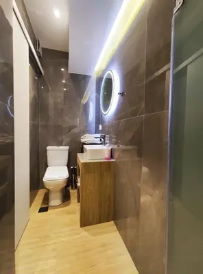 a bathroom with a toilet and a sink and a mirror at Athens Stay 15 in Athens