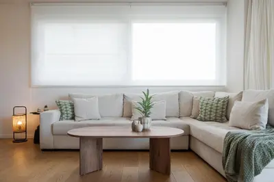 a living room with a couch and a table at Athenian Riviera Elegant Residence in Athens