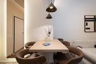 a living room with a table with chairs and a couch at Athens City Modern Apartments in Athens