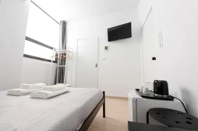 a bedroom with a bed with towels on it at Ati-Key Residence in Athens