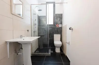 a bathroom with a sink and a toilet at Ati-Key Residence in Athens