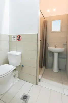 a bathroom with a toilet and a sink at Ati-Key Residence in Athens